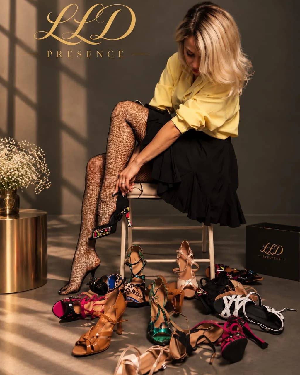 Elina putting on a patterned LLD dance heel